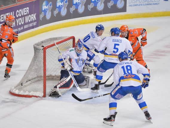 STRIKE ONE: Eric Meland, far right, scores Sheffield Steelers' first goal against Fife Flyers in Saturday night's win. Picture courtesy of Dean Woolley.