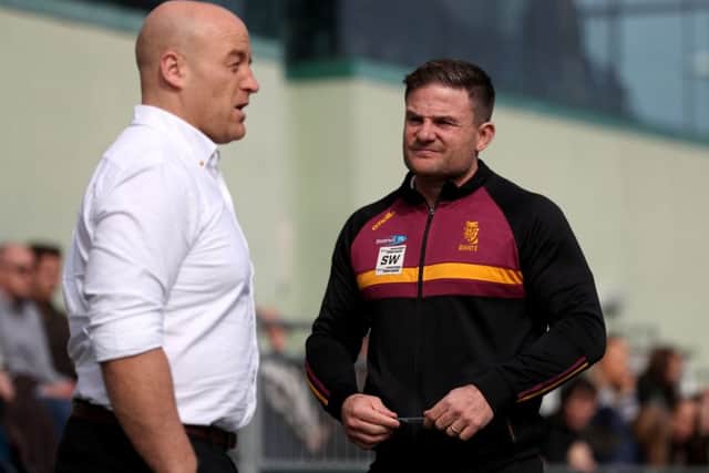 Huddersfield Giants coach Simon Woolford, right, talks with London Broncos' coach Danny Ward last season. Picture: Bradley Collyer/PA