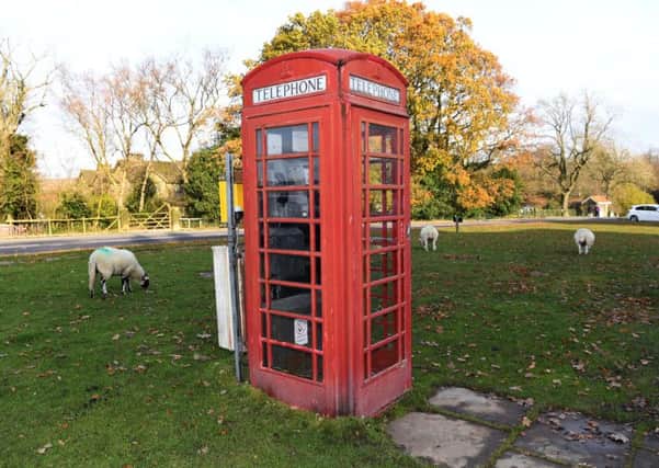 A traditional red telephone box.