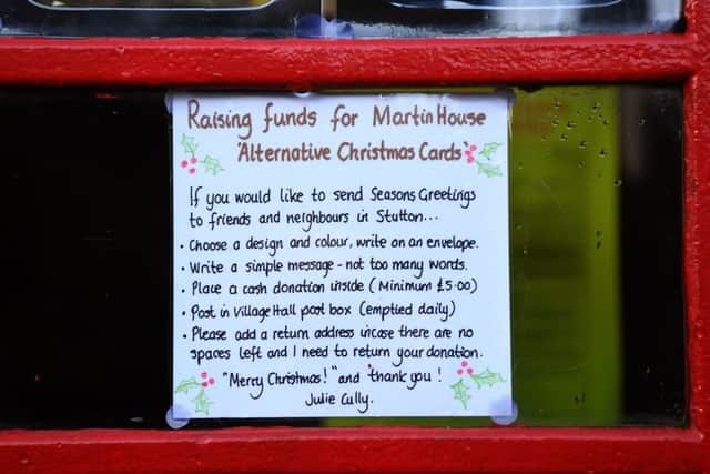 A festive twist has been revealed to the innovative uses for decommissioned phone boxes and one village has turned theirs into a Christmas card. Rather than sending paper cards this year, villagers in Stutton near Tadcaster are posting messages of goodwill onto the old red phone box, with the proceeds to be donated to Martin House Hospice.