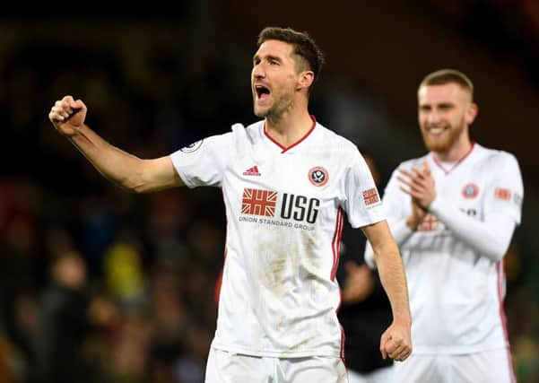 Going strong: Sheffield United's Chris Basham celebrates after the final whistle of the Premier League match at Carrow Road, Norwich.