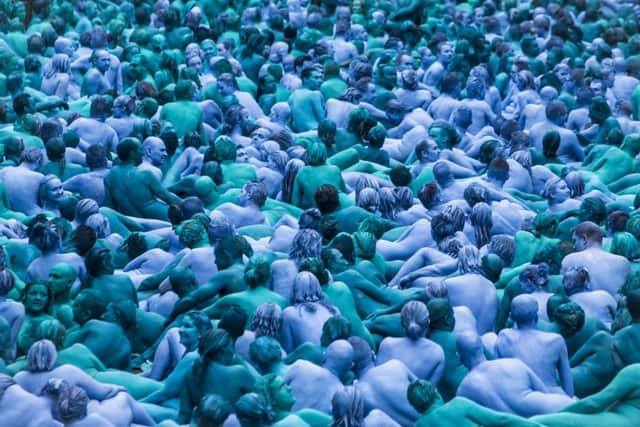 People take part in an installation titled Sea of Hull by artist Spencer Tunick in Hull.