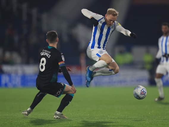 Huddersfield Town's Alex Pritchard is struggling with a persistent knee injury