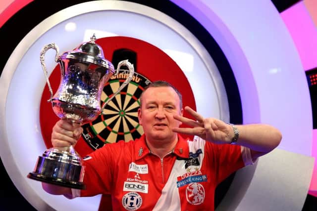 Glen Durrant celebrates winning three titles in a row at the BDO World Professional Darts Championship at The Lakeside. Picture: Steven Paston/PA Wire