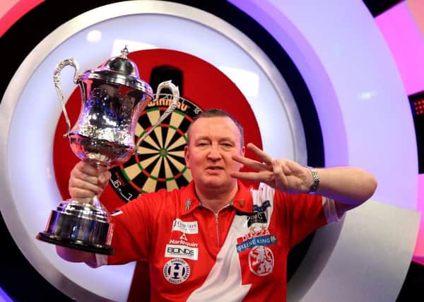 Glen Durrant celebrates winning three titles in a row at the BDO World Professional Darts Championship at The Lakeside. Picture: Steven Paston/PA Wire