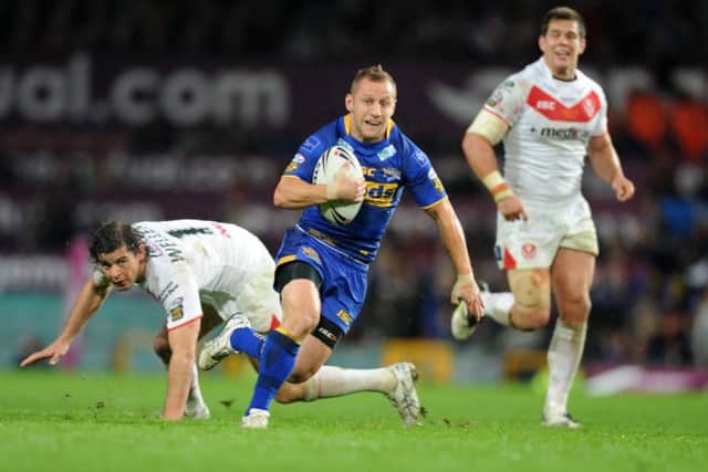 Rob Burrow scores his memorable opening try for Leeds Rhinos against St Helens in 2011 at Old Trafford. Picture: Steve Riding.