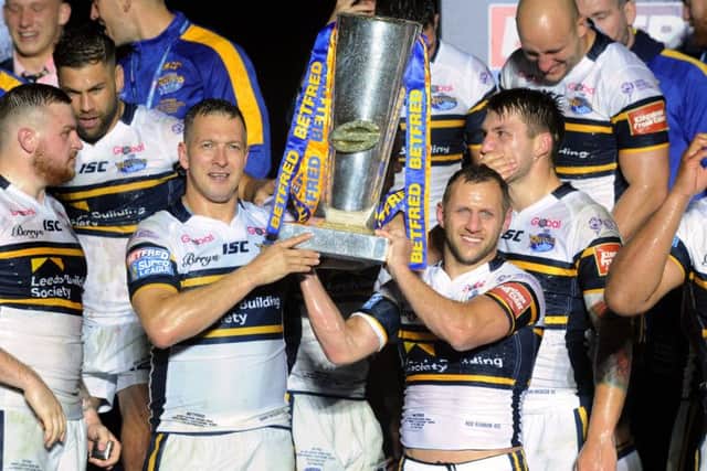 Danny McGuire and Rob Burrow lift the Super League Grand Final Tro at Old Trafford in 2017.  Picture: Bruce Rollinson