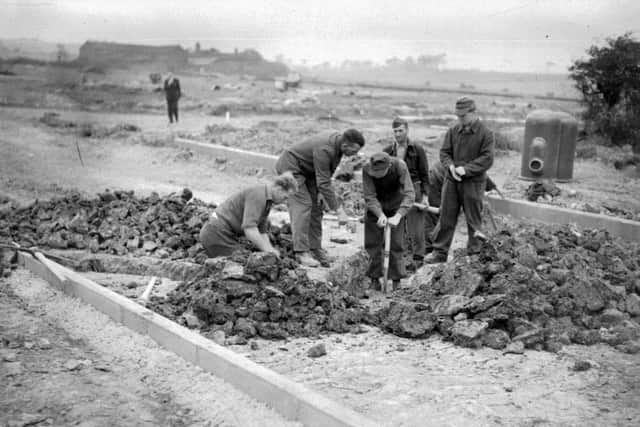 POWs working on the Farfield estate in Farsley, Leeds. German POWs proved useful as a labour source after the war, and the government was reluctant to repatriate them as a result.