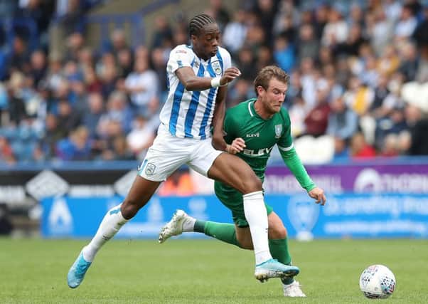 Terence Kongolo, left, is on his way out of Huddersfield (Picture: PA0