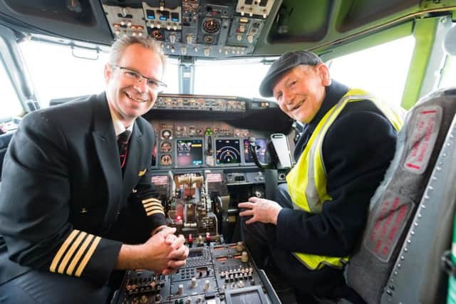 Eddie in the cockpit with Captain Martin Beaton