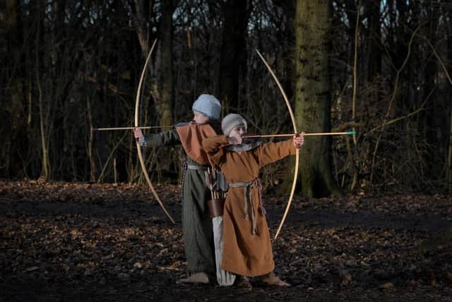 Jorja and Lucy Grayshon demonstrating their archery skills. Picture by Simon Hulme.