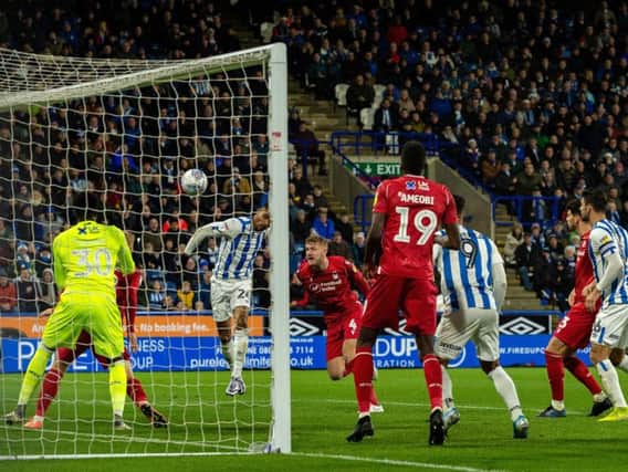 Steve Mounie heads Huddersfield Town into a 2-0 lead