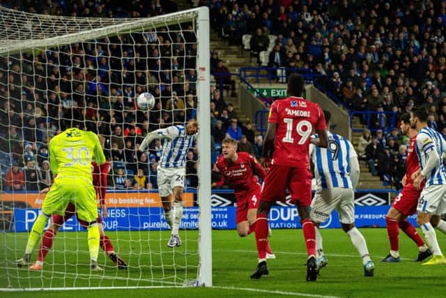 Steve Mounie heads in Huddersfield's second goal. Picture: Bruce Rollinson