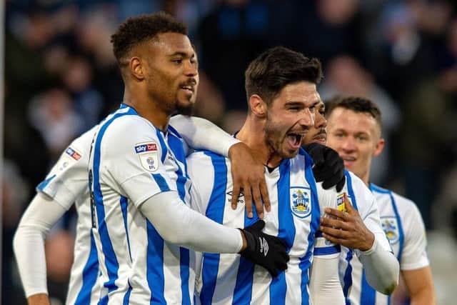 GET IN: Christopher Schindler celebrates scoring Huddersfield Town's opening goal against Nottingham Forest.  Picture: Bruce Rollinson