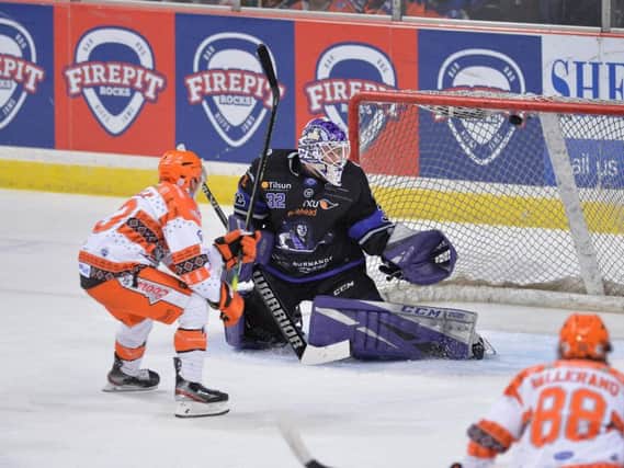 Brendan Connolly shows quick hands to backhand the puck home for Sheffield Steelers' third goal in the 5-3 win over Glasgow Clan. Picture courtesy of Dean Woolley.