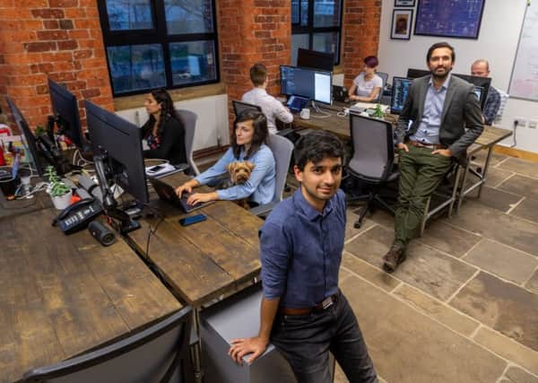 Software firm Synap as a result of its growth in business has moved into its new office in Castleton Mill, Leeds. Pictured (centre) Omair Vaiyani, CTO, (Chief Technology Officer) and James Gupta, CEO, (Chief Executive Officer). Pic: James Hardisty.