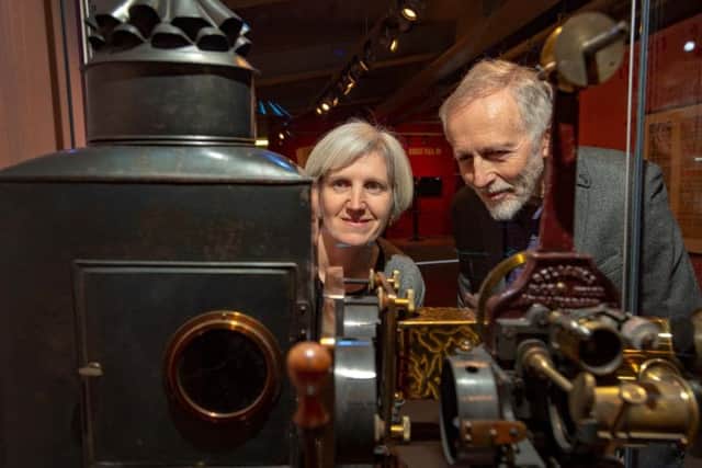 Toni Booth and Professor Ian Christie, with a 1906 Reliance Animatograph Patent Projector by Robert Paul, part of the continuing exhibition. Picture: Bruce Rollinson.
