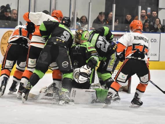 PILE ON! Ashley Smith's Hull Pirates goal comes under pressure during Saturday's 5-2 defeat at NIHL National leaders Telford Tigers. Picture courtesy of Steve Brodie.