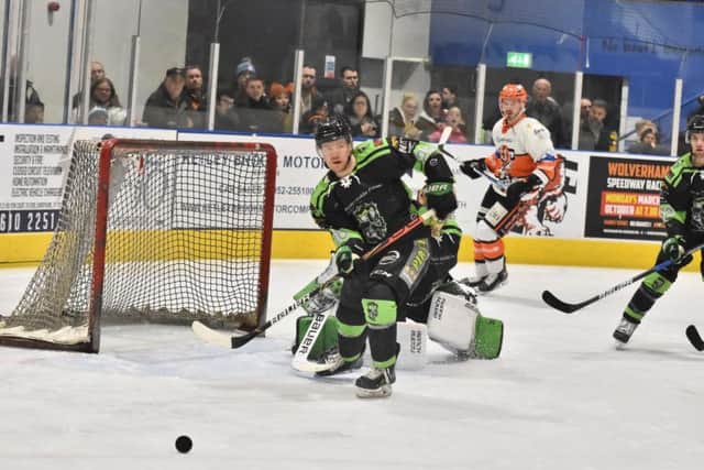 Hull's Chris Wilcox clears the danger against Telford Tigers on Saturday night. Picture courtesy of Steve Brodie.