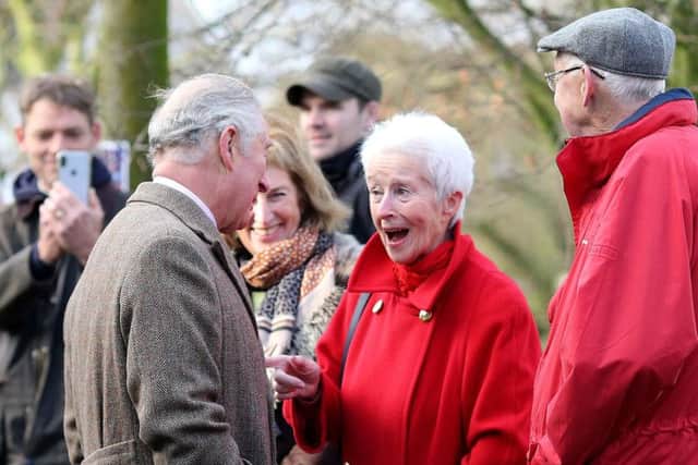 The Prince of Wales speaks to local residents and business people during a visit to Fishlake. Credit: Nigel Roddis/PA