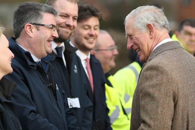 The Prince of Wales speaks to local residents and business people during a visit to Fishlake. Credit: Nigel Roddis/PA