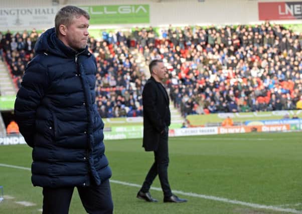Rovers manager Grant McCann and Peterborough manager Darren Ferguson.