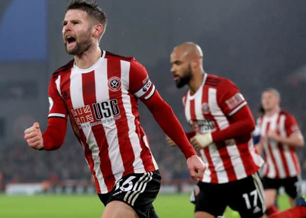 Sheffield United's Oliver Norwood (left) celebrates scoring his side's first goal against Watford (Picture: PA).