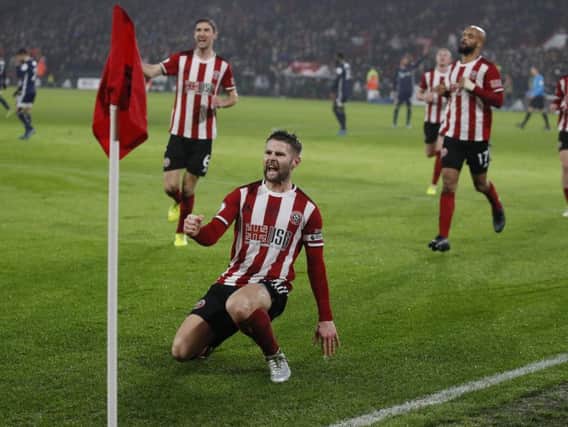 Oliver Norwood celebrates scoring Sheffield United's first-half equaliser from the penalty spot