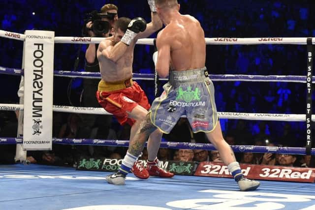 Josh Warrington knocks down Sofiane 
Takoucht for a second time earlier this year.