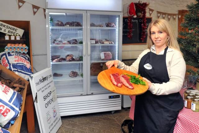 Lucy Lunn with Dexter Sirloin Steaks, one of the heritage and rare breed cuts available at The Horny Cow.