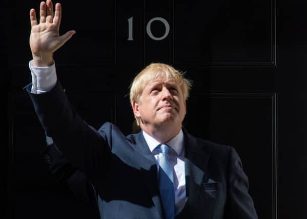 Boris Johnson looks to the skies after becoming Prime Minister.