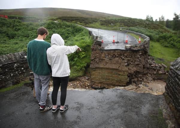 This road on Grinton Moor was washed away when  the Yorkshire Dales was flooded.