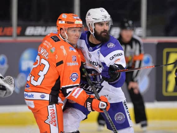 KEY COMPONENT: Jonas Liwing battles with former Steelers' forward Mathieu Roy earlier this season. Picture courtesy of Dean Woolley/EIHL.