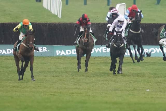 Danny Cook riding Midnight Shadow (orange cap) clears the last to win The Paddy Power Broken Resolutions Already Dipper Novices' Chase at Cheltenham. Picture: Alan Crowhurst/Getty Images
