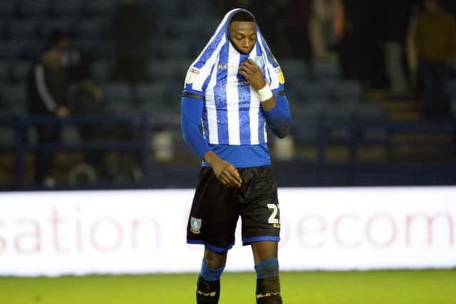 Dejected Sheffield Wednesday defender Dominic Iorfa trails off the pitch.