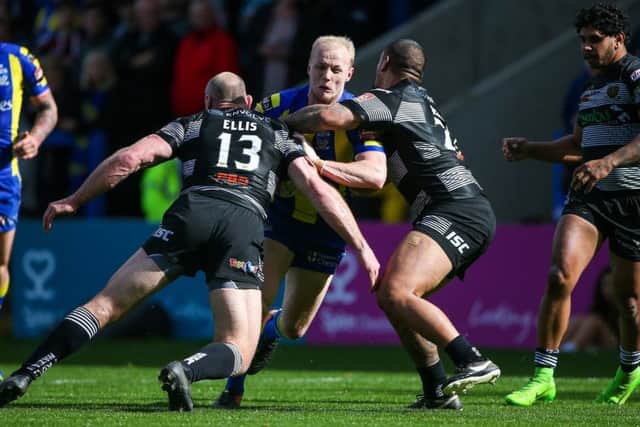 Rhys Evans battles for Warrington against Hull FC's Gareth Ellis and Sika Manu back in 2016. Picture: Alex Whitehead/SWpix.com
