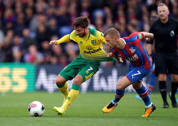 INCOMING: Patrick Roberts (left) battles for the ball with Crystal Palace's Max Meyer while on loan at Norwich City in the Premier League back in September. Picture: John Walton/PA