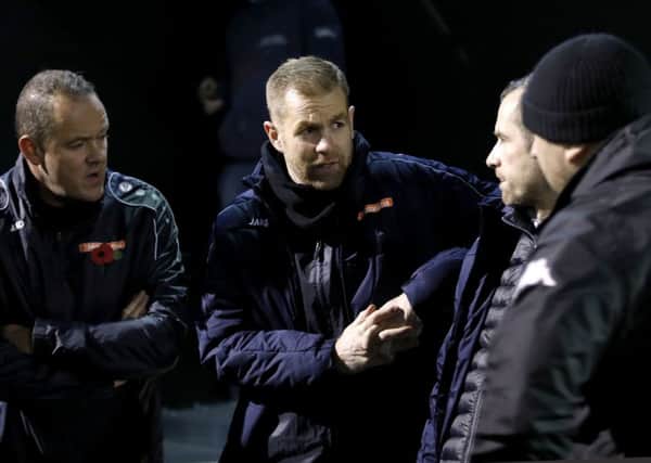 In the dark: Harrogate Town manager Simon Weaver during a power outage at the FA Cup first round match v Portsmouth.