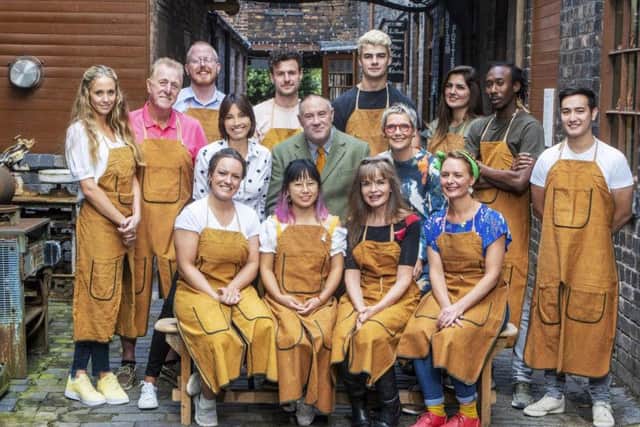 Presenters Melanie Sykes (centre left), Keith Brymer Jones (centre) and Sue Pryke (centre right) surrounded by the 12 contestants of The Great Pottery Throw Down. Picture: Mark Bourdillon/Channel 4
