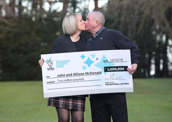 John and Allison McDonald, from Stockton On Tees, celebrating their £2 million Lotto jackpot win at Crathorne Hall, North Yorkshire.  Photo: Danny Lawson/PA Wire