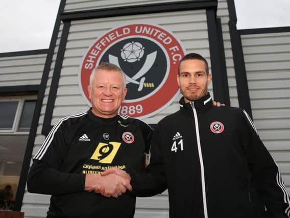 Manager Chris Wilder (left) welcomes new Sheffield United signing Jack Rodwell