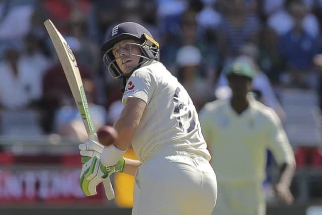 England's batsman Jos Buttler watches as the ball flies down to the boundary. (AP Photo/Halden Krog)