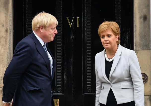 Boris Johnson with Nicola Sturgeon, First Minister of Scotland.