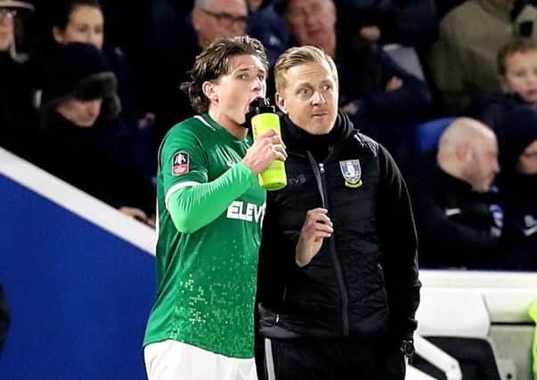 Sheffield Wednesday's Adam Reach (left) with manager Garry Monk (right) during the FA Cup third round match at the AMEX Stadium.