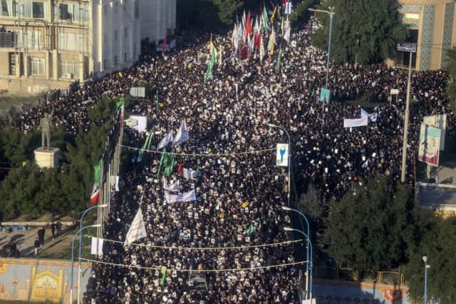 An aerial view shows mourners attending a funeral ceremony for Gen. Qassem Soleimani and his comrades, who were killed in Iraq in a U.S. drone strike, in the southwestern city of Ahvaz, Iran, Sunday, Jan. 5, 2020. The body of Gen. Qassem Soleimani arrived Sunday in Iran to throngs of mourners, as President Donald Trump threatened to bomb 52 sites in the Islamic Republic if Tehran retaliates by attacking Americans.