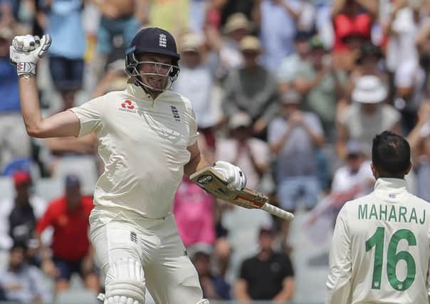 England's batsman Dom Sibley celebrates scoring one hundred during day four of the second cricket test between South Africa and England. (AP Photo/Halden Krog)