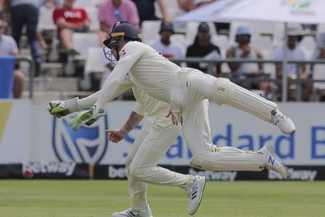 England's wicketkeeper Jos Buttler narrowly misses catching out South Africa's Dean Elgar. (AP Photo/Halden Krog)