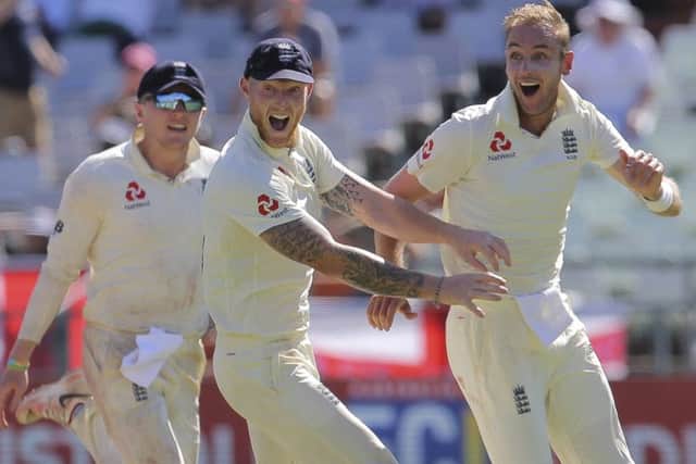 Stuart Broad and the England team celebrate the wicket of Rassie van der Dussen (AP Photo/Halden Krog)