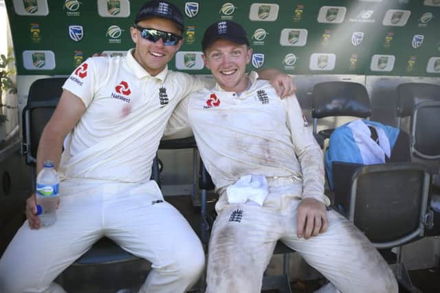 England players Sam Curran and Dom Bess celebrate victory in Cape Town, South Africa. (Picture: Stu Forster/Getty Images)