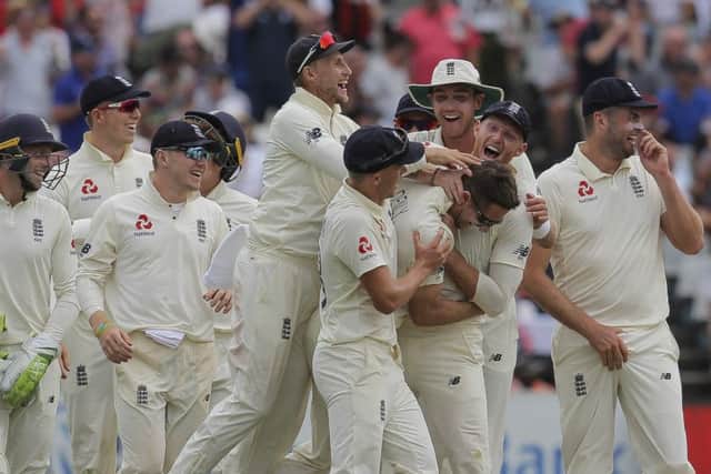 England celebrate the wicket of Dean Elgar on their way to victory against South Africa in the second Test in Cape Town. PIcture: AP/Halden Krog.